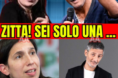 ELLY SCHLEIN PERDE IL CONTROLLO IN STUDIO, LE TELECAMERE TREMANO E FIORELLO INTERVIENE ALL’IMPROVVISO: UNA MOSSA FUORI COPIONE, UN GESTO CHE CAMBIA L’ARIA E LASCIA TUTTI A CHIEDERSI COSA SIA DAVVERO SUCCESSO DIETRO LE QUINTE.  Non è una semplice discussione. È una sequenza che accelera, una tensione che sale parola dopo parola. Schlein entra con tono deciso, il pubblico percepisce subito che non sarà una comparsata qualunque. Le frasi diventano affilate, gli sguardi si incrociano, l’atmosfera si fa elettrica.  Poi accade qualcosa che nessuno aveva previsto. Fiorello, abituato a governare il ritmo e l’ironia, cambia passo. Non interrompe per scherzo, non alleggerisce. Interviene. E lo fa in modo netto, misurato, ma definitivo. Lo studio si blocca, la regia indugia, i social iniziano a correre.  C’è chi parla di provocazione calcolata, chi di scivolone clamoroso. C’è una vittima mediatica? Un colpo studiato? O un tentativo di ribaltare il racconto davanti alle telecamere? Le risposte non arrivano subito, e forse non arriveranno mai del tutto.  È un trailer politico travestito da intrattenimento. Un momento che divide, polarizza, accende tifoserie. E mentre il video rimbalza ovunque, resta una domanda sospesa: chi ha davvero fermato chi, e perché proprio in quel momento?
